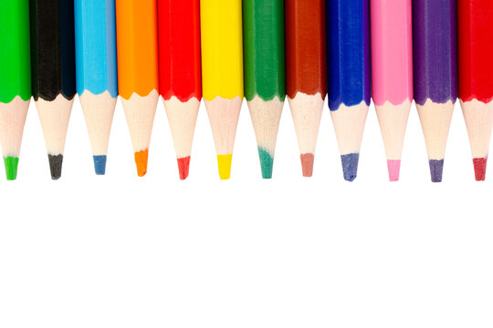Colored pencils isolated on white background, top view. Colored pencils on a white background. Copy space.