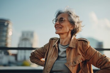Cheerful senior woman enjoying city views, casual lifestyle.