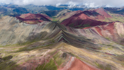 Aerial Drone view of Vinicunca Winikunka Montaña de Siete Colores Rainbow Mountain Andes Mountains Peru