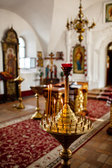 Candles in the candle for churches. Photo of the illuminated cerca and candle in the candle