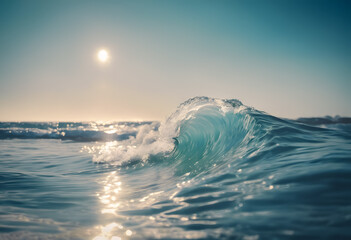 Close-up of a crystal clear wave with the sun glistening on the ocean horizon.