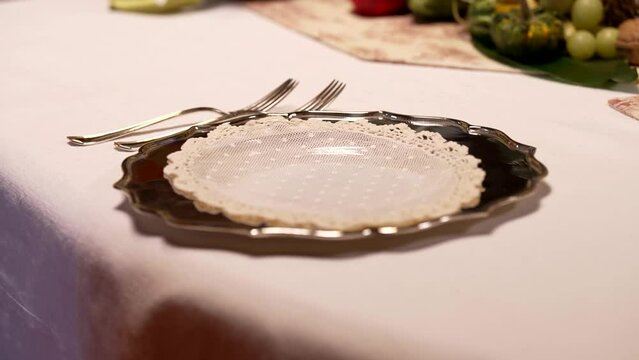 the waitress prepares an elegant table