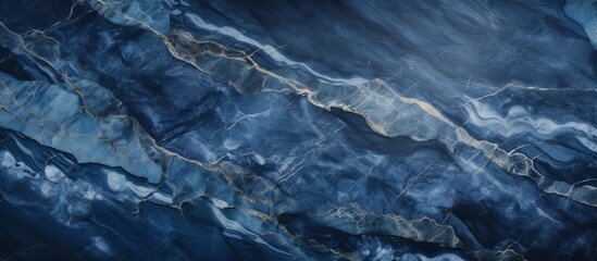 A detailed closeup of a swirling blue marble texture, resembling the fluidity of water, sky, and...
