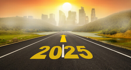 New Year 2025 entrance concept.  Text 2025 written on the road in the middle of the asphalt road at sunset and skyscrapers in the background. Concept of planning, goal, travel 