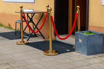 entrance area with golden stands and red ribbons