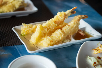 Nice  view of prepared Japanese prawns tempura recipe with ginger ponzu sauce at restaurant