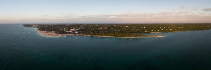 Stoff pro Meter Nungwi Strand, Tansania Panorama of kendwa beach and ocean on tropical sea coast with sandy beach.Wooden fishing boat near the shore. Summer travel in Zanzibar, Africa,Tanzania.