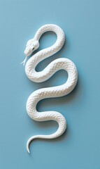 An albino snake is coiled on a blue background