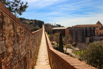 Girona old city wall fortification, venerable 9th-century city walls with walkways, towers and scenic vantage points of city views of Girona, Catalonia, Spain