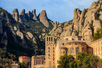 View of the famous Santa Maria de Montserrat Abbey located on the mountain of Montserrat nearby...