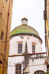 Ceramic tile covered dome of a church at Via Tribunali in Naples, Italy - 767356663