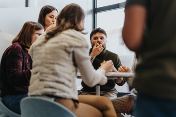 A diverse group of business people enjoying their lunch break and discussing business ideas while refueling their energy with pizza.