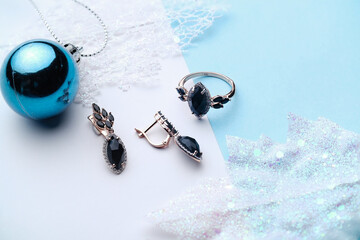 Elegant jewelry set. Jewellery set with gemstones. Product still life concept. Ring, necklace and...