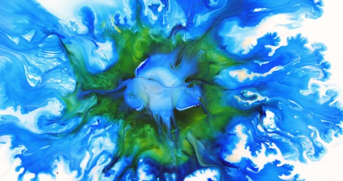 Abstract art of painting. Free flow of blue and yellow paint on a white background. Magical flow and waving of flowers. Fluid art painting.