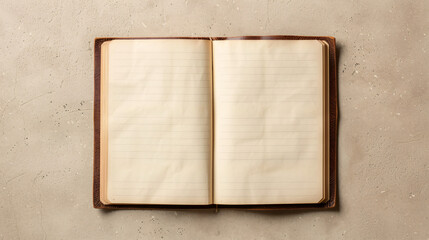 An overhead shot of an open notebook with blank pages on a smooth beige background.
