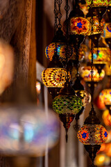 Variety of traditional vintage lanterns with an ornament lit up