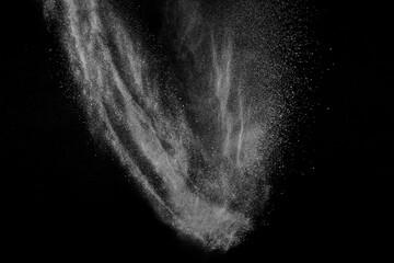 Abstract white dust on black background. Light smoke texture. Powder explosion. Splash water...