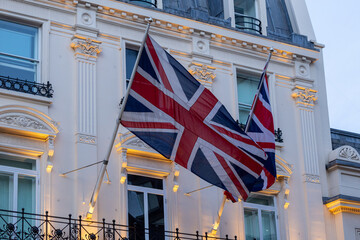 British flag flying on the balcony of a historic building in central London