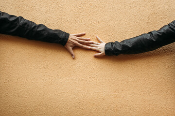 Two Hands Touching on Wall