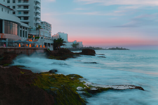 Waves crashing into the coast. Sunset hours. Condado Beach, San Juan, Puerto Rico.