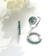 Elegant jewelry set. Jewellery set with gemstones. Product still life concept. Ring, necklace and...