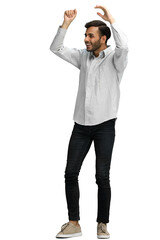 Fototapeta premium a man on a green background rejoices. raised his hands up