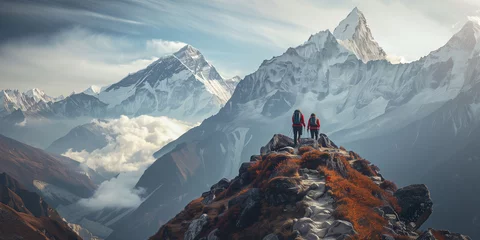 Papier Peint photo autocollant Himalaya Trekkers Overlooking Majestic Snow-Capped Mountain Range
