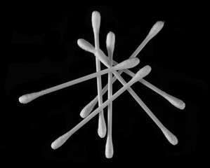 Cotton buds pile, swabs for ear cleaning isolated on black, top view - 767396094