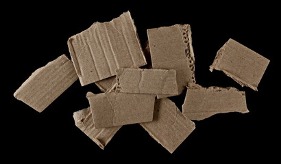Group cardboard scraps isolated on black background and texture - 767396289