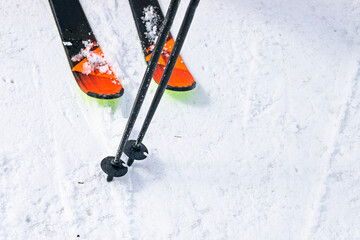 skis and poles on the ski slope. start of the ski season