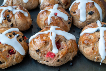 Homemade traditional hot cross buns with fruit and raisins. - 767406073