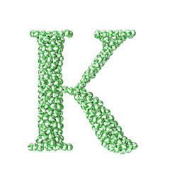 Symbol made of green volleyballs. letter k