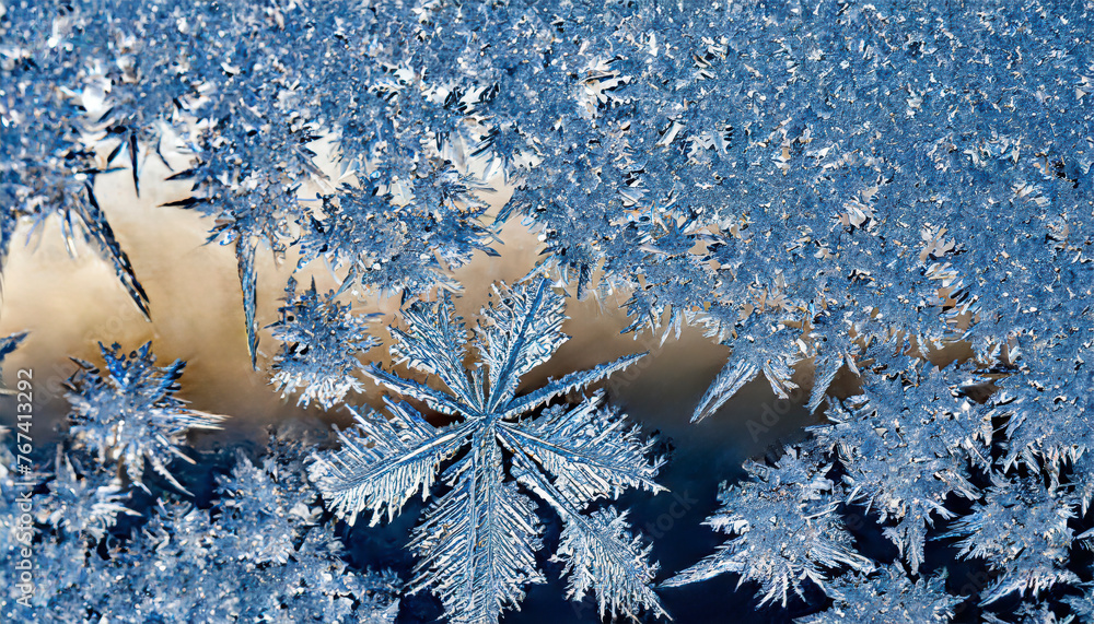 Poster a close up of snowflakes on a blue background. the snowflakes are all different shapes and sizes, an