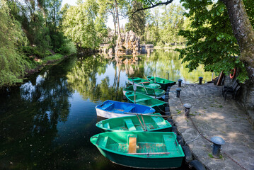 Tranquil Day at Rybárska Bašta: Enjoying Rajecke Teplice, Slovakia Spa Park with Small Boats on the Serene Lake