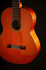 Classical Spanish flamenco guitar close up, dramatically lit isolated on black background with copy space.