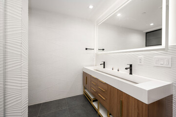 Fototapeta na wymiar Spacious white bathroom with combined shower and sink