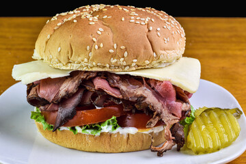 roast beef sandwich with  tomatoes and cheese