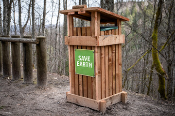 Save Earth. Dustbin on the walking path