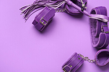 Sex toys on purple background, closeup