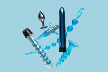 Flying sex toys on blue background