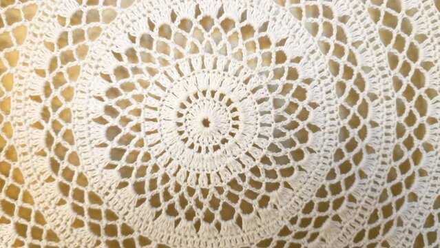 Exquisite handmade crochet lacework detail with intricate vintage pattern and artistic handiwork in white cotton