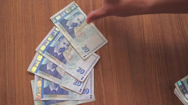 Female hands are laid out by Bulgarian levs