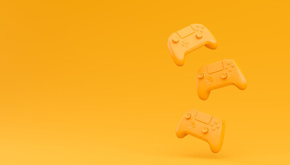 Video game joysticks or gamepads in plain monochrome yellow color background © Vasyl Onyskiv