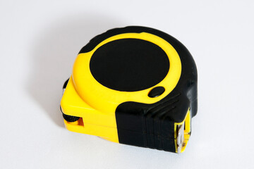 yellow measuring tape on a white background