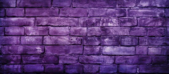A closeup shot of a vibrant purple brick wall showcasing a unique pattern of rectangular bricks in shades of magenta and electric blue, creating a striking contrast with the stone wall background