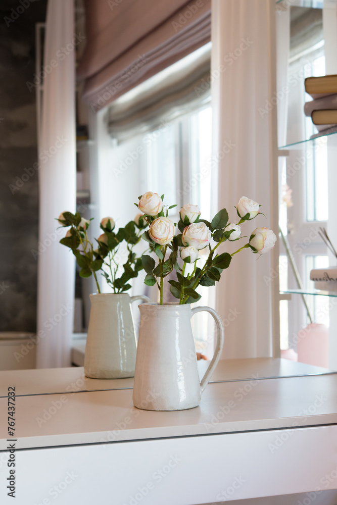 Sticker Bouquet of flowers in a vase in front of a mirror in the bedroom. Interior details.	