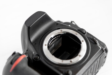 dslr camera lying on white background