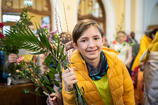An 11-year-old boy in church on Palm Sunday.
