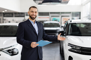 Car salesman welcoming with open arms