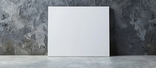 A white blank canvas is displayed leaning against a gray wall, serving as a mock-up poster frame and canvas template.
